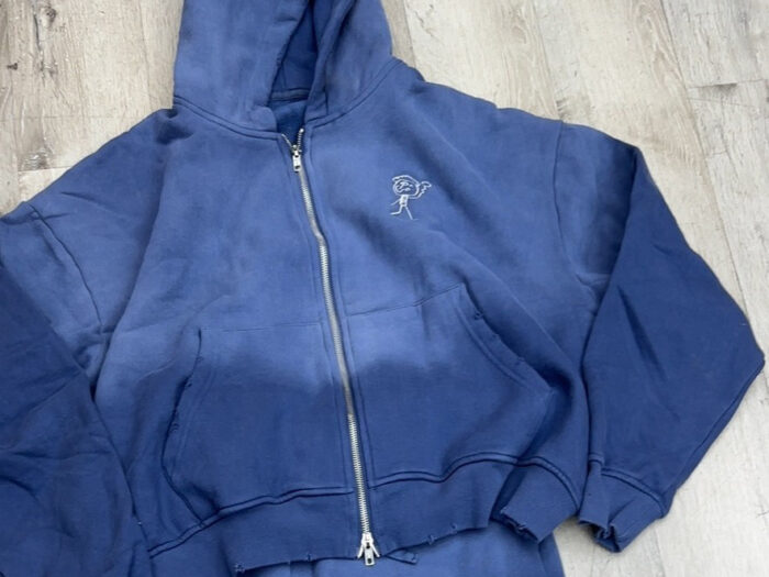 Blue hoodie and pants with stick figure design.